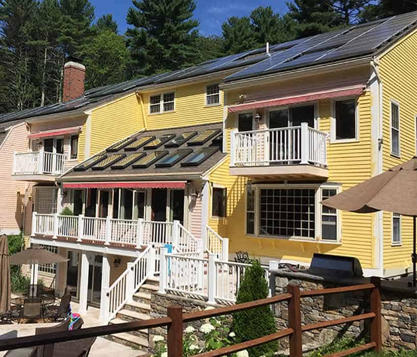 Exterior house and deck painting in Hopkinton, MA.